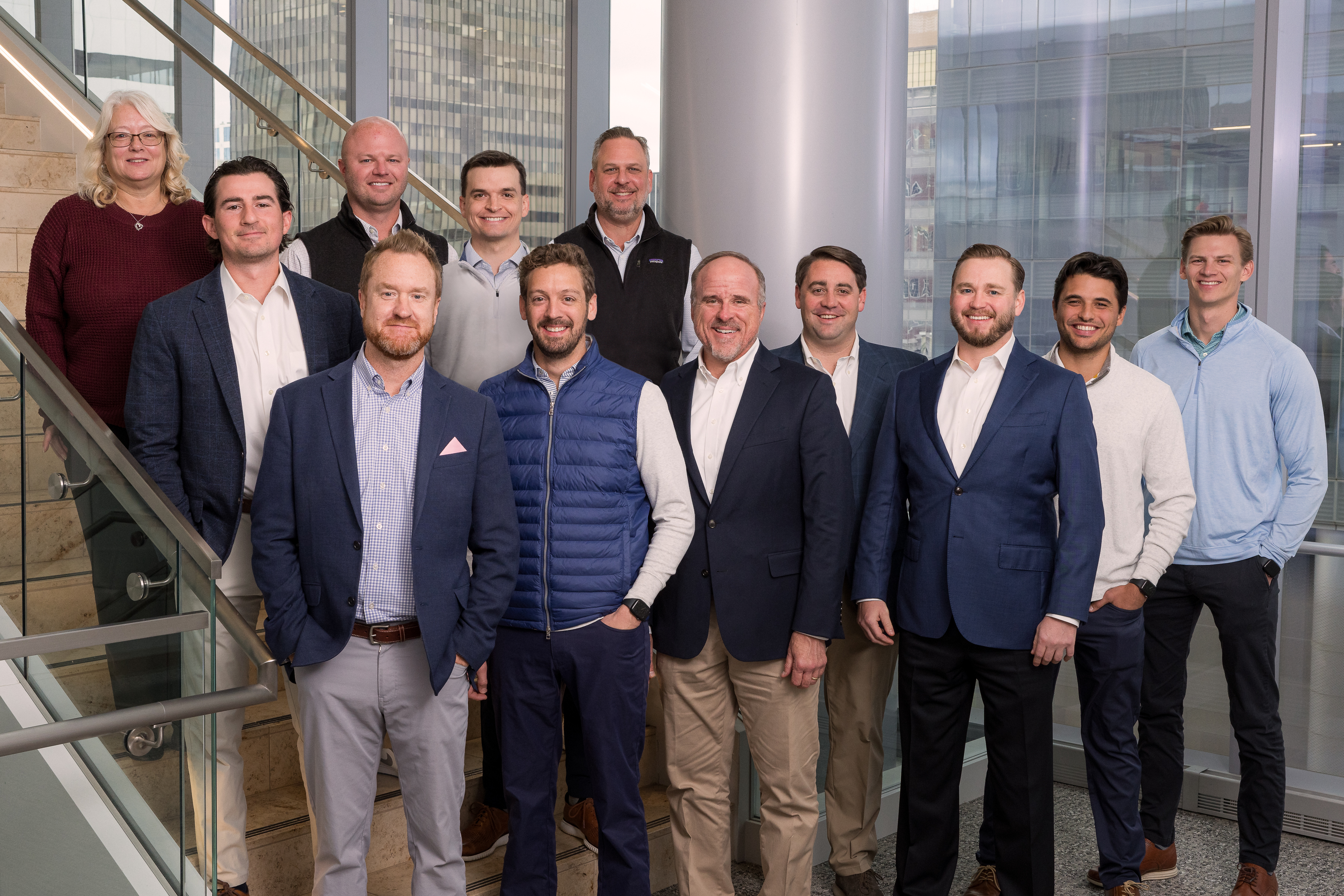 12 people standing on stairs posing for a picture, Sponsor Finance team