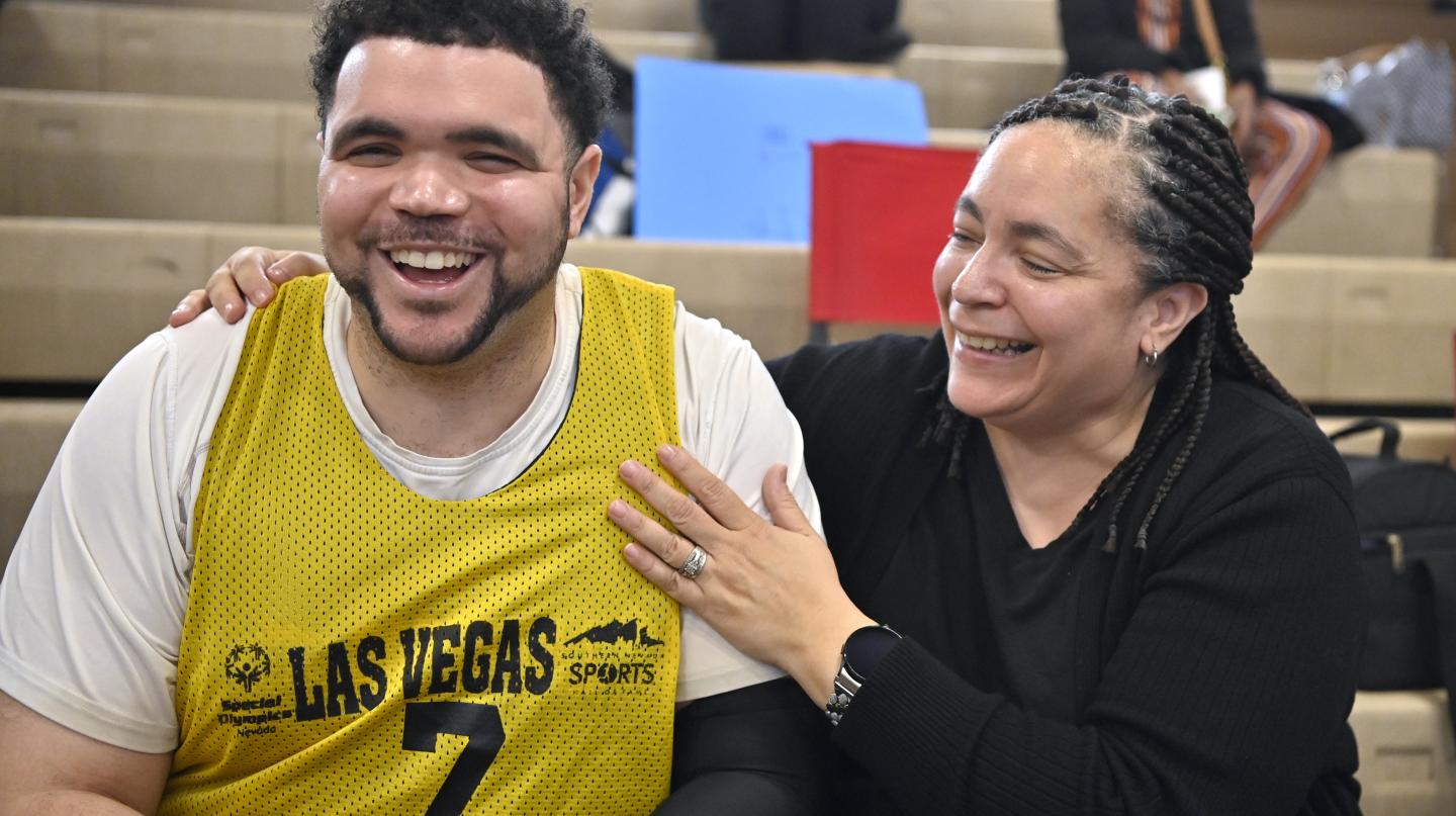 Basketball player and mother hugging